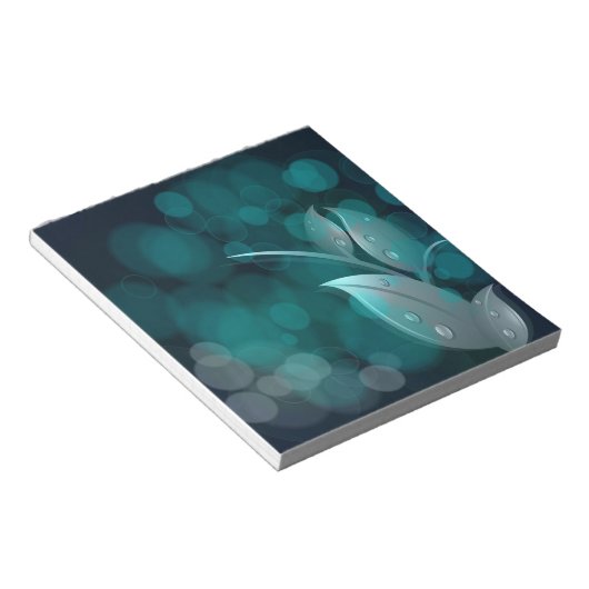 Blauwgroen bokeh bladeren notitieblok (Schuin)