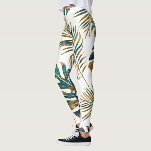 Blauwgroen en gouden gepatterde tropische bladeren leggings (Links)