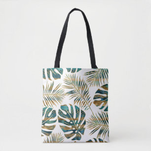 Blauwgroen en gouden gepatterde tropische bladeren tote bag
