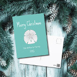 Blauwgroen kerstdagen met tropische beugel feestdagenkaart<br><div class="desc">Tropisch blauwgroen kerstgroen briefkaart met  kerstfeest,  met een zanddollar- en witte typografische vormgeving,  Met aanpasbare letters kunt u uw eigen informatie toevoegen. Geweldig voor het verzenden van goede wensen aan geliefden dit vakantieseizoen.</div>