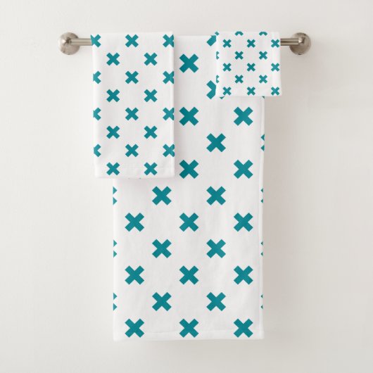 Blauwgroen kruisstiften op wit bad handdoek (Insitu)