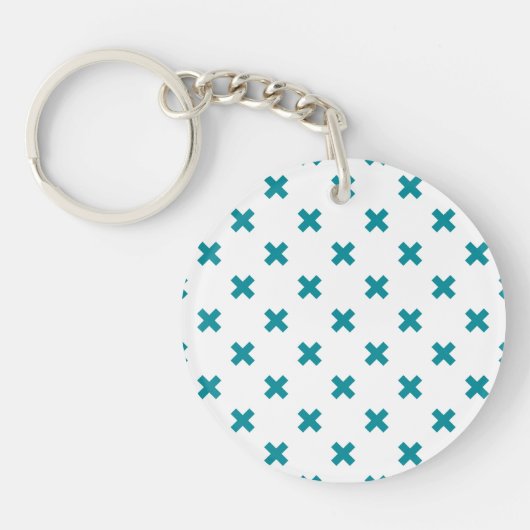 Blauwgroen kruisstiften op wit sleutelhanger (Voorkant)