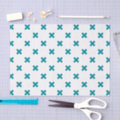 Blauwgroen kruisstiften op wit tissuepapier (Craft)
