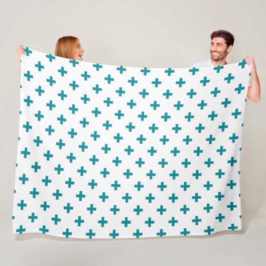 Blauwgroen polka kruist wit fleece deken (In situ)