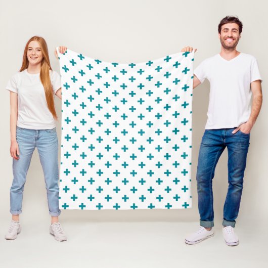 Blauwgroen polka kruist wit fleece deken (In situ)