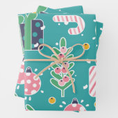 Blauwgroen roze en gele kerstartikelen inpakpapier vel (In situ)