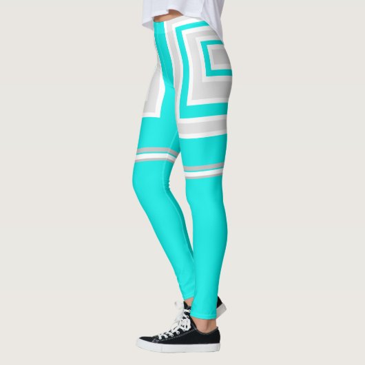 Blauwgroen, witte en grijze leggings (Links)