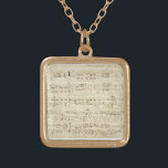 Blauwmuziek op perkamenthandgeschreven in inkt goud vergulden ketting<br><div class="desc">Oude  muziek met handgeschreven zwarte inkt op een antiek beige perkament met noten. Herinneringen van een tijd geleden,  toen muziek met inkt werd geschreven. De notaties en de krabbels aan de zijkant geven het een persoonlijke aanraking.</div>