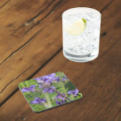 Blauwogige darner libel op paarse bloemen bier onderzetter