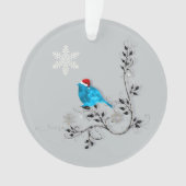 Blauwvogel kijkt naar een kerstsnowflake ornament (voorkant)