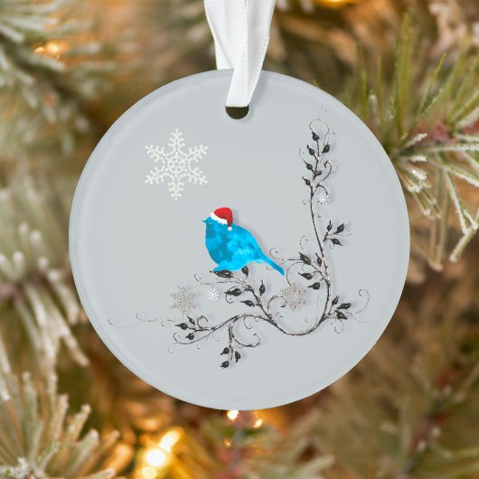 Blauwvogel kijkt naar een kerstsnowflake ornament