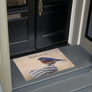 Blauwvogel van geluk verwelkomt je deurmat