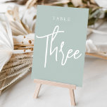 Bleek Sage Green Hand Scripted Table DRIE Kaart<br><div class="desc">Eenvoudige en chic table number cards in Eucalyptus Green en white maken een elegante verklaring bij uw bruiloft of gebeurtenis. Het ontwerp kenmerkt "lijst [aantal]"in een eyecatching mengeling van klassieke serif en handgeschreven manuscript het schrijven. Het ontwerp herhaalt zich aan beide zijden. Afzonderlijk genummerde kaarten worden apart verkocht; beveel elk...</div>