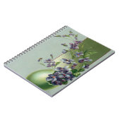  bloeiende paarse bloemen in een paasei notitieboek (Linkerzijde)