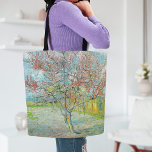 bloeiende perzikboom | Vincent van Gogh Tote Bag<br><div class="desc">Flowering Peach Tree (1888) van de Nederlandse kunstenaar Vincent van Gogh. Origineel kunstwerk is een olieverf op doek met een prachtig landschap van bloeiende roze bomen. Gebruik de ontwerpgereedschappen om aangepaste tekst toe te voegen of het afbeelding te personaliseren.</div>