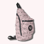 Bloemen en gezichten monogram roze sling bag<br><div class="desc">Deze stijlvolle draagtas is voorzien van een all-over handgetekend patroon van gezichten en bloemetjes en je monogram initiaal aan de voorkant. Drie compartimenten met ritssluiting kunnen eenvoudig uw sleutels, portemonnee, telefoon, camera en nog veel meer opslaan. Draag het als een crossbody of over één schouder, en bevestig de verstelbare riem...</div>