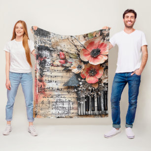 Bloemen met rustieke pianotoetsen en verouderde mu fleece deken