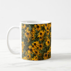 Bloemen van de Black eyed Susan, Bloemstuk, Fotogr Koffiemok
