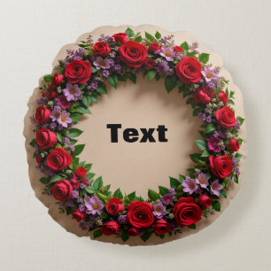Bloemenslinger met rode rozen en roze bloemen rond kussen