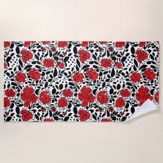 bloemmotief in rood, zwart en wit strandlaken
