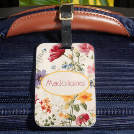 bloemmotief in zachte kleuren met naam bagagelabel