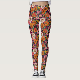 bloemmotief met felle kleuren op zwart leggings