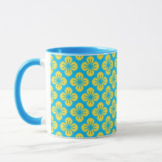Bloempatroon in geel en turquoise mok