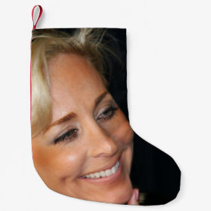 Blond vrouw glimlachen kleine kerstsok