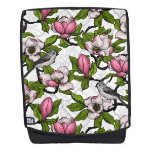 Bloomende magnolia en titmuisvogel rugtassen