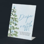 Blue Bow Kerstboom Baby shower Luier Raffle Reclamebord Met Voetstuk<br><div class="desc">Blue Bows Christmas Tree Baby shower Luier Raffle Sign 🎀🎄💙 Maak je baby shower zowel leuk als praktisch met dit charmante luierverlofteken! Met elegante blauwe bogen, een prachtig versierde kerstboom en een besneeuwd winterontwerp, nodigt dit bord gasten uit om deel te nemen door luiers mee te nemen voor een kans...</div>