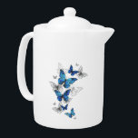 Blue Flying Butterflies Morpho Theepot<br><div class="desc">Vliegende Blauwe Butterflies morpho en witte vlinders op een lichte abstracte achtergrond. Morpho. Ontwerp met blauwe vlinders morpho.</div>
