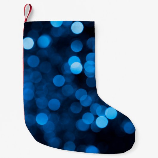 Blue glitter bokeh texture lights kleine kerstsok (Voorkant)