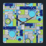 Blue Green Art Deco-Glas in lood Vierkante Klok<br><div class="desc">Deze muurklok heeft een vierkant kunstdecopatroon in digitaal gekleurd glas. Een kleurrijk geometrisch ontwerp in kleuren blauw,  aquamarine en groen,  ideaal voor een pop kleur in uw thuisdecor. Je kunt het patroon op deze klok groter of kleiner maken.</div>