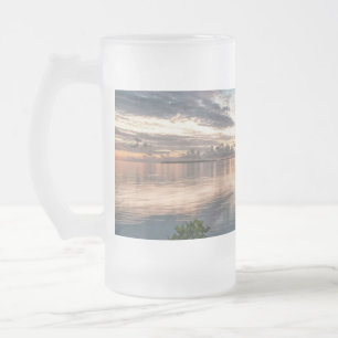 blue sky with red and dark clouds reflected on sea matglas bierpul