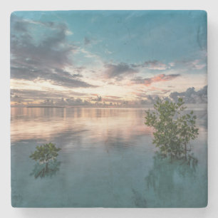 blue sky with red and dark clouds reflected on sea stenen onderzetter