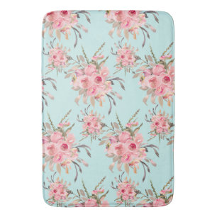 Blush roze bloemen op lichtblauw badmat
