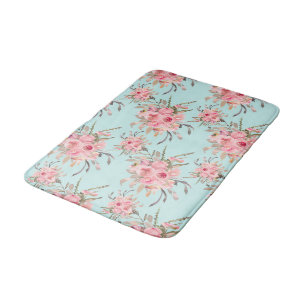 Blush roze bloemen op lichtblauw badmat