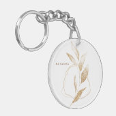 Bodemvormig bladerbruin met een moderne goudvorm sleutelhanger (Voorkant Links)