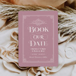 Boek onze datum Dusty Roos  Hoesje bruiloft Save The Date<br><div class="desc">Deze unieke bruiloft bewaar de datumkaarten voor boekenliefhebbers zijn voorzien van een boekomslagontwerp met een rollen die de trouwdatum lijsten, een titel "Book Our Date", de namen van de bruid & bruidegom als de auteurs, een stoffige rozen roze achtergrond / boekkleur (die kan worden gewijzigd), compleet met een verlovingen foto...</div>
