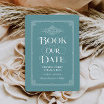 Boek onze datum Gedempte Aqua  Hoesje Bruiloft Save The Date<br><div class="desc">Deze unieke bruiloft bewaar de datumkaarten voor boekenliefhebbers zijn voorzien van een boekomslagontwerp met een rollen die de trouwdatum lijsten, een titel "Book Our Date", de namen van de bruid & bruidegom als de auteurs, een gedempte aquablauwe achtergrond / boekkleur (die kan worden gewijzigd), compleet met een verlovingen foto van...</div>