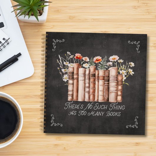 Boeken met bloemen en citaten op zwart Notitieboek