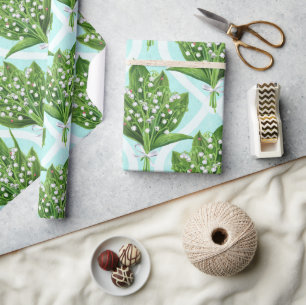 Boeket van lelie van de vallei bloemen op blauw cadeaupapier
