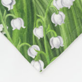 Boeket van lelie van de vallei bloemen op blauw fleece deken (Hoek)