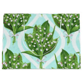 Boeket van lelie van de vallei bloemen op blauw groot cadeauzakje (Voorkant)