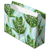 Boeket van lelie van de vallei bloemen op blauw groot cadeauzakje (Voorkant Gekanteld)