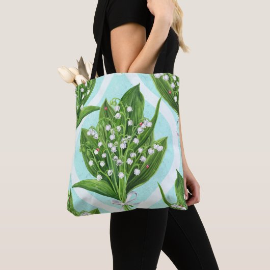 Boeket van lelie van de vallei bloemen op blauw tote bag (Dichtbij)
