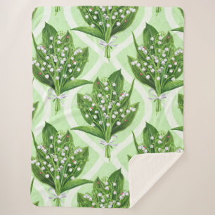 Boeket van lelie van de vallei bloemen op groen sherpa deken