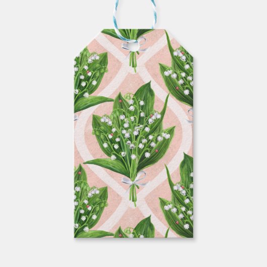 Boeket van lelie van de vallei bloemen op roze cadeaulabel (Voorkant)