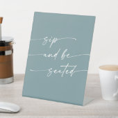 Boho Chic Seafoam Blauwgroen Sip Be Seated Wedding Reclamebord Met Voetstuk (Insitu)