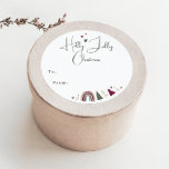 Boho Rainbow en Hearts Holly Jolly vanaf nu verkri Ronde Sticker<br><div class="desc">Vier het plezier van het seizoen met deze boho regenboog en harten hulst vrolijk kerstfeest van klassieke ronde sticker. Het unieke en chique bewerkbare script creëer een vleugje charme en individualiteit. Het eenvoudige ontwerp is voorzien van kleurrijke boheemse regenbogen, harten en kerstbomen die een grillige wintersfeer oproepen. Met een strakke,...</div>